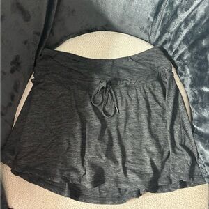 Kyodan size small soft jersey tennis skirt with draw string for adjustable fit.